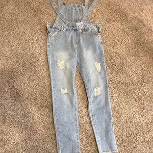 Skinny leg distressed women’s overalls